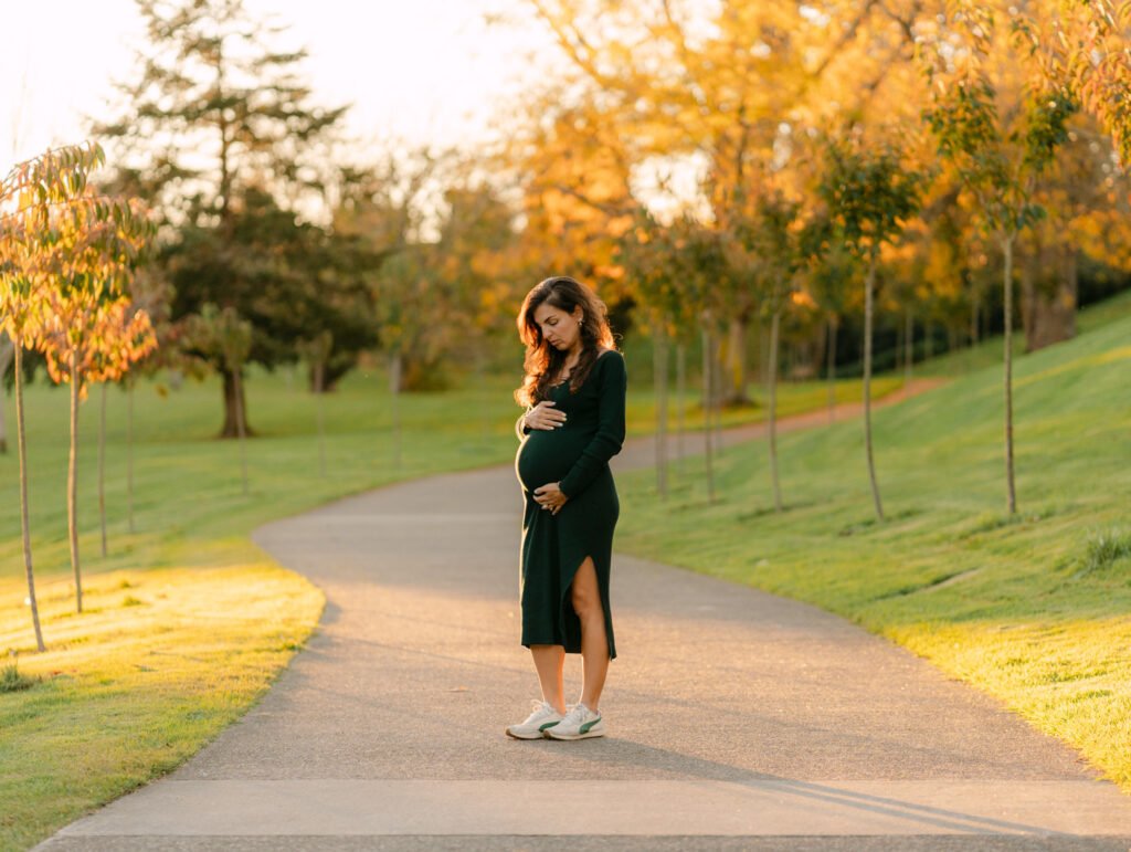 Maryam outdoors at sunset during a maternity portrait shoot in Hamilton