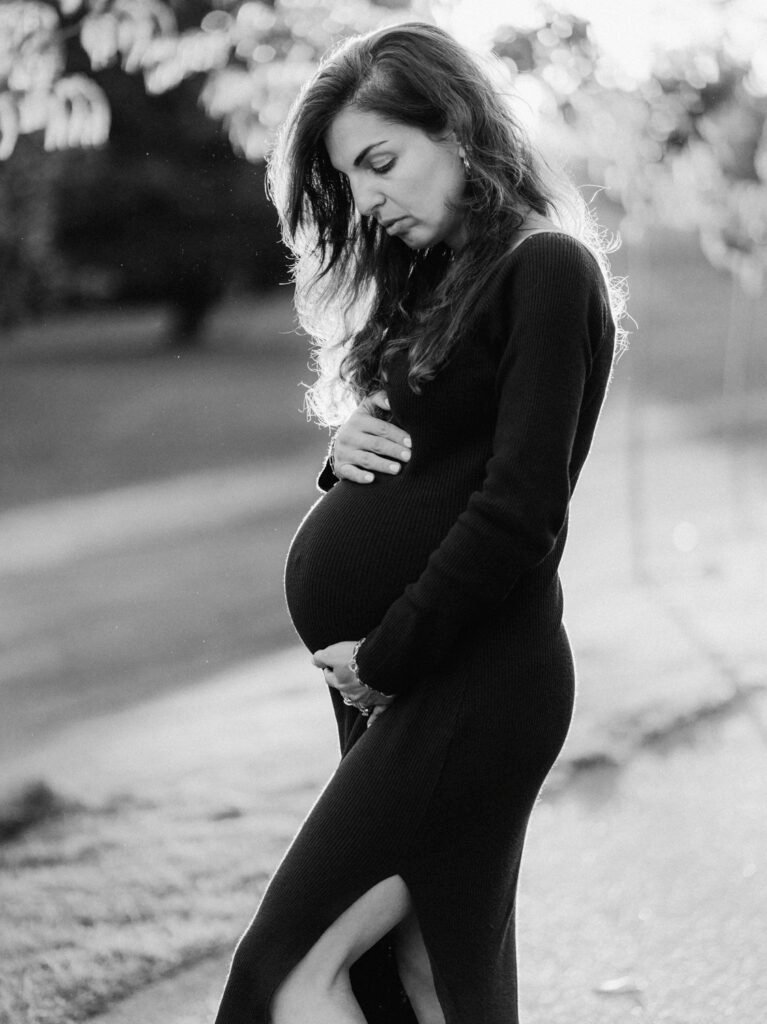 Maryam outdoors at sunset during a maternity portrait shoot in Hamilton