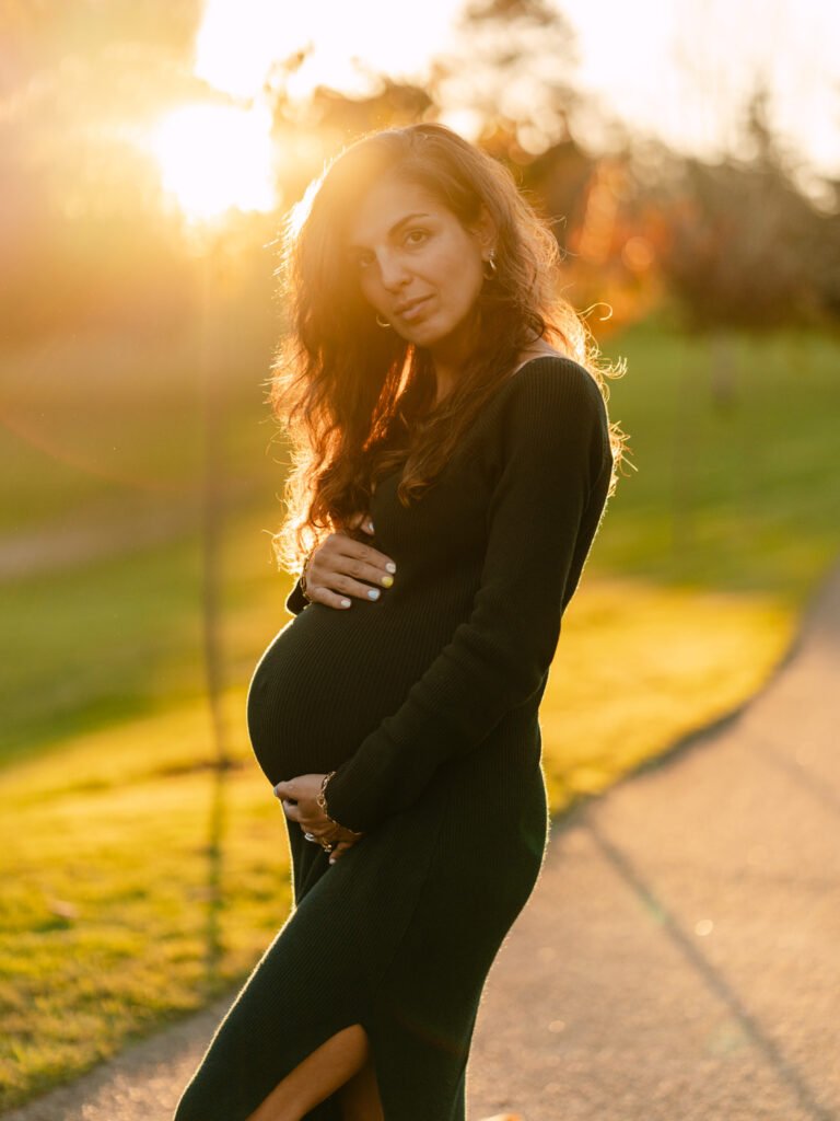 Maryam outdoors at sunset during a maternity portrait shoot in Hamilton